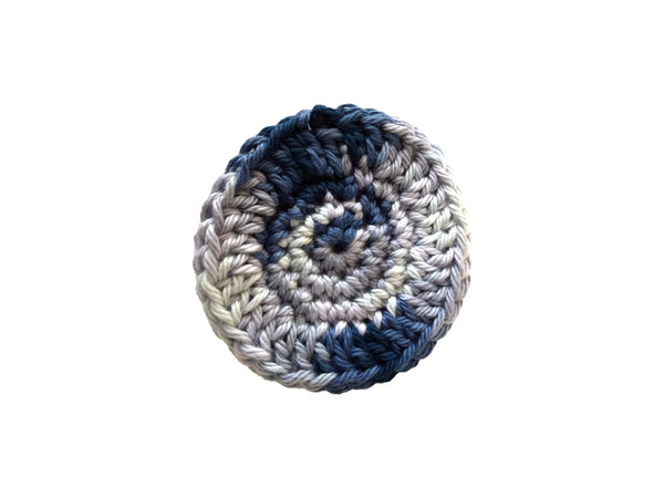 Handmade crocheted cotton facial scrubby in blue denim colors