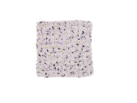 Handmade crocheted wash cloth in whites and purples with dots of lime